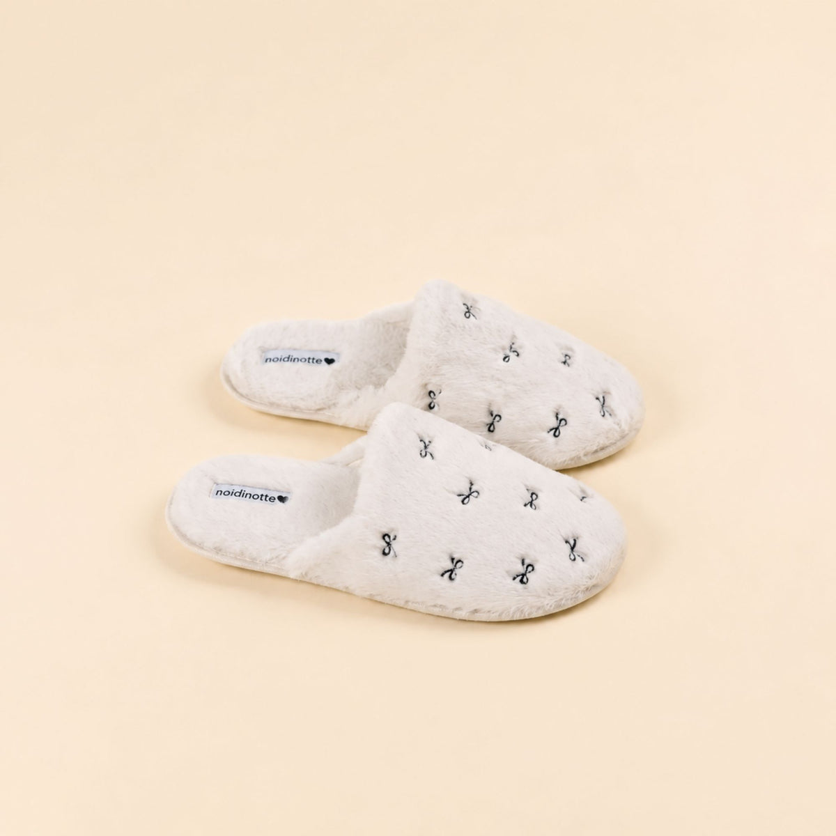 Pantofole in eco pelliccia con fiocchetti Noidinote PF3295