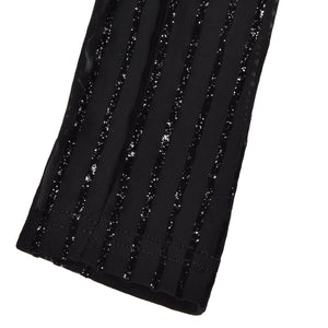 Maglia nera con manica semitrasparente righe glitter Jadea Galà 4453