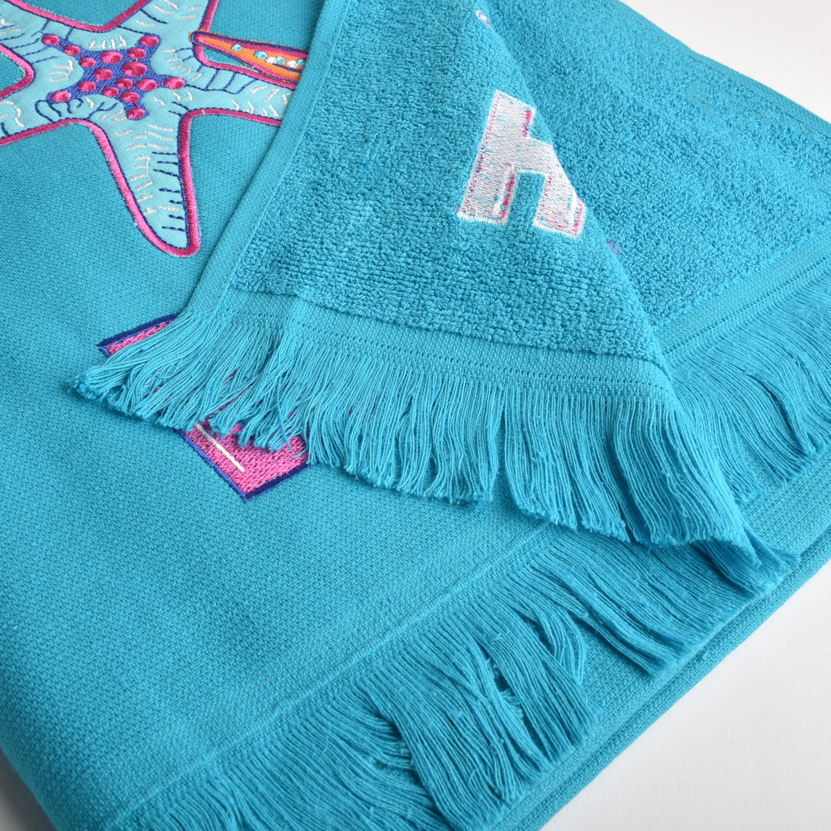 Telo mare Vingi spugna "Beach" turchese con frange 100% cotone